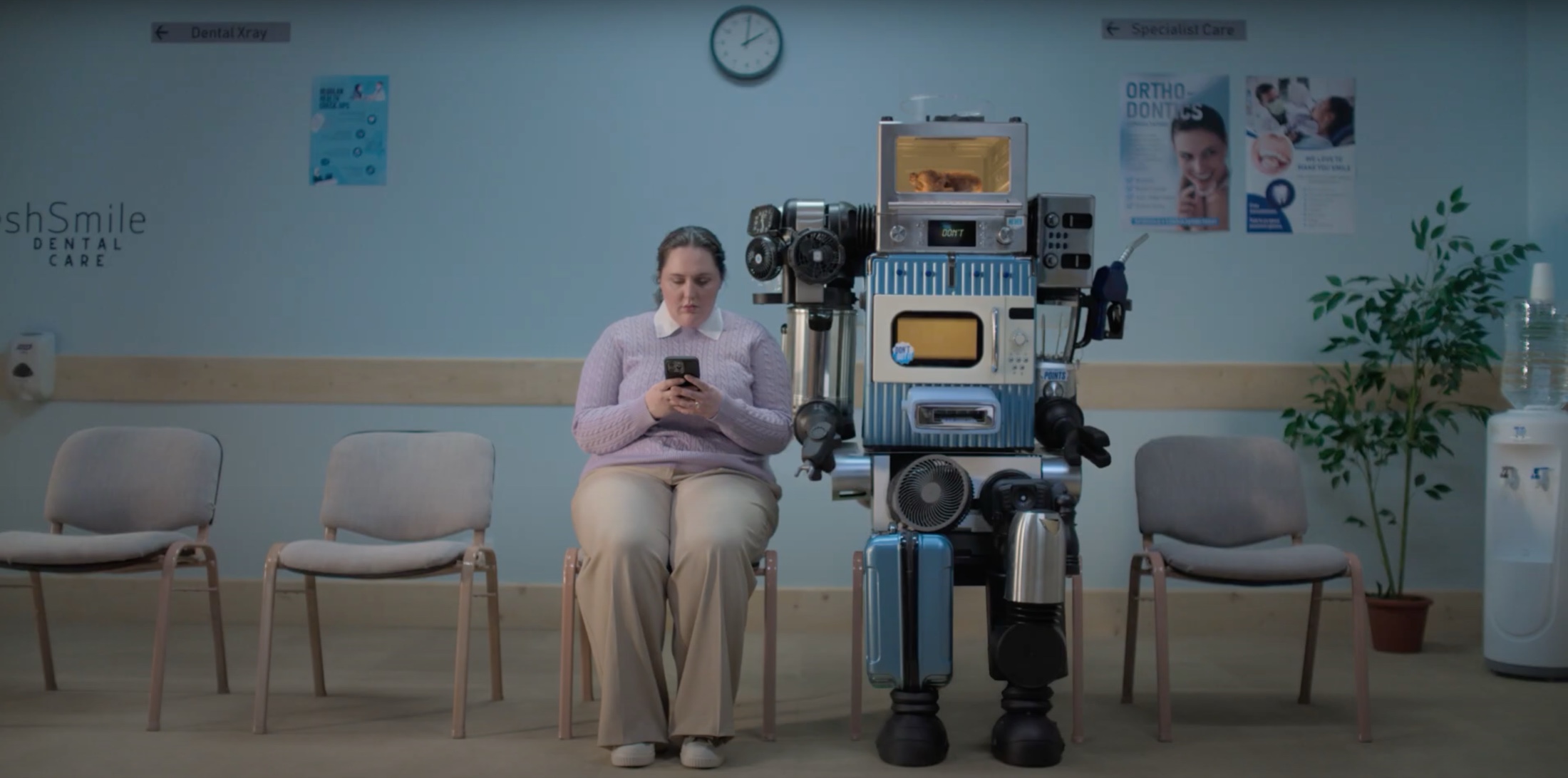 The completed Flybuys robot appearing beside the campaign performer in the final television commercial