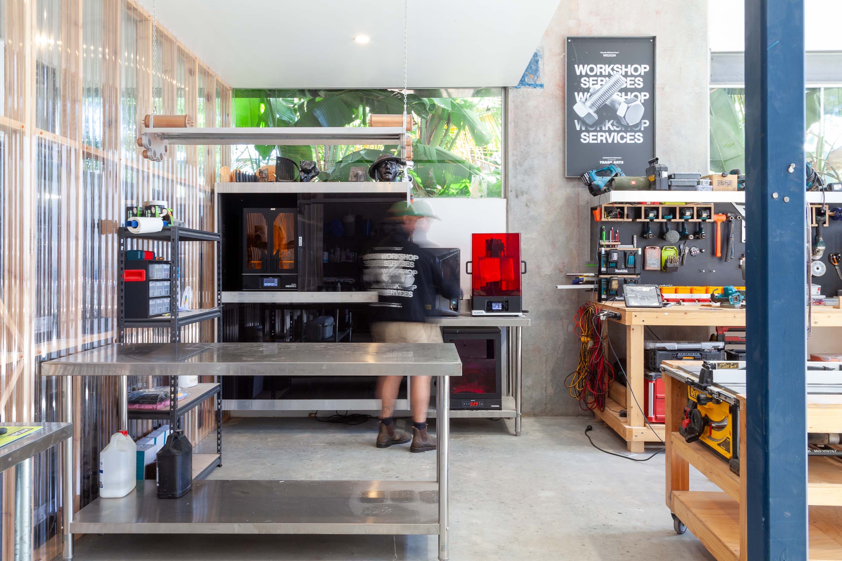 Workshop production in motion at Trade Arts, with 3D printers, tools and fabrication benches